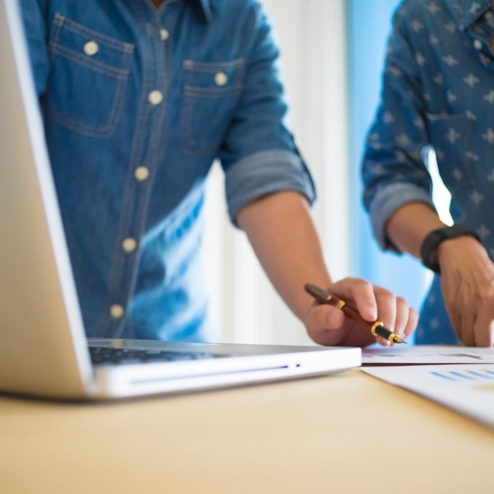 business-team-working-on-new-business-plan-with-modern-digital-computer-with-copyspace